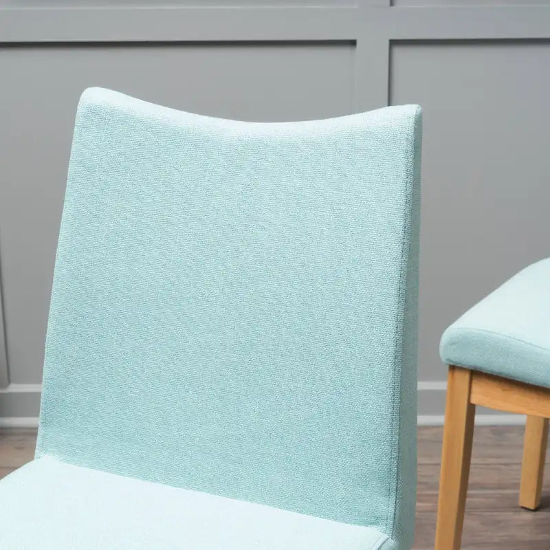 Chaise de salle à manger tapissée en tissu de style milieu du siècle avec pieds en bois massif
