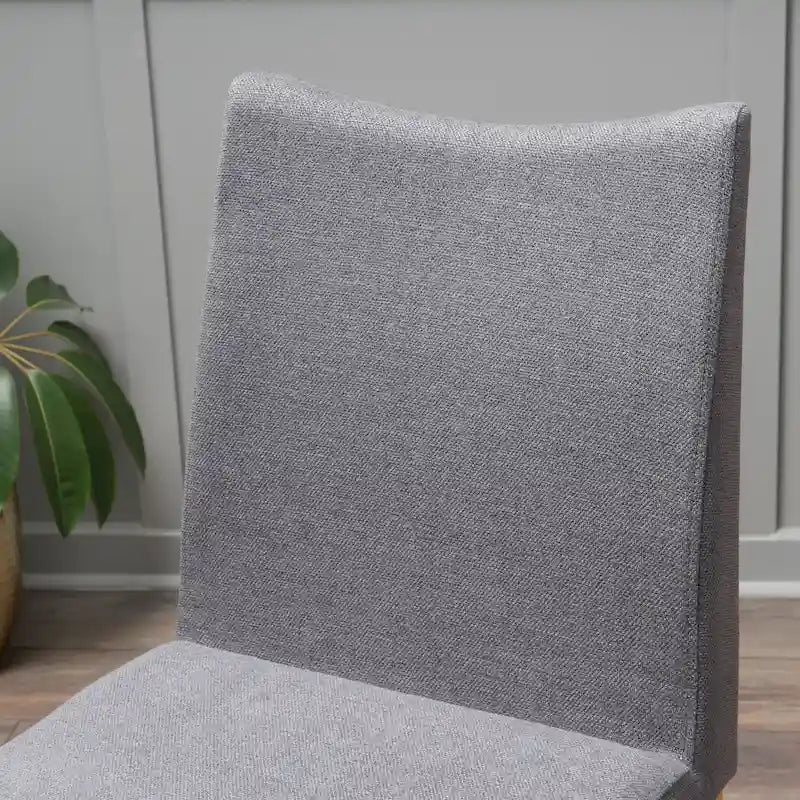 Chaise de salle à manger tapissée en tissu de style milieu du siècle avec pieds en bois massif